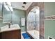 Updated bathroom with a large walk-in shower and double vanity at 613 4Th Ne St, Fort Meade, FL 33841