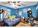 Cozy bedroom with ceiling fan and large bed at 613 4Th Ne St, Fort Meade, FL 33841