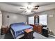 Cozy bedroom with carpeted floors, fan, and natural light at 613 4Th Ne St, Fort Meade, FL 33841
