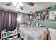 Spacious bedroom with a bed and wall decor at 613 4Th Ne St, Fort Meade, FL 33841