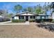 House exterior featuring a covered porch and landscaping at 613 4Th Ne St, Fort Meade, FL 33841