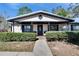 Inviting front porch with brick pavers and lush hedges at 613 4Th Ne St, Fort Meade, FL 33841