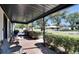 Brick porch with comfortable seating overlooking neighborhood at 613 4Th Ne St, Fort Meade, FL 33841