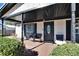 Welcoming front porch features brick pavers, covered area, and comfortable seating at 613 4Th Ne St, Fort Meade, FL 33841