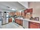 Kitchen with wood cabinets and stainless steel appliances at 613 4Th Ne St, Fort Meade, FL 33841