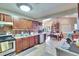 Galley kitchen with wood cabinets and dining area at 613 4Th Ne St, Fort Meade, FL 33841