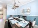 Dining Room with dark wood table and light blue walls at 6330 Oil Well Rd, Clermont, FL 34714