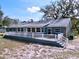 Ranch-style home with large deck and spacious backyard at 6330 Oil Well Rd, Clermont, FL 34714