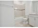 Clean bathroom with a bathtub and white cabinets at 8707 Sw 57Th Ln, Ocala, FL 34481