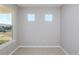 Bright, airy room with natural light featuring two windows and neutral paint, ready for your personal touch at 8707 Sw 57Th Ln, Ocala, FL 34481