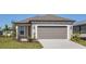 Charming single-Gathering home featuring a two-car garage and well-maintained landscaping at 8707 Sw 57Th Ln, Ocala, FL 34481