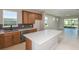 Beautiful kitchen features stainless steel appliances, a stylish backsplash, and an island with counter seating at 8707 Sw 57Th Ln, Ocala, FL 34481