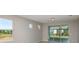 Bright living room featuring large windows and sliding glass doors, offering ample natural light at 8707 Sw 57Th Ln, Ocala, FL 34481