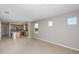 Open concept living area flows into a modern kitchen, showcasing neutral tones and ample space at 8707 Sw 57Th Ln, Ocala, FL 34481