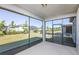 Screened patio with views of the backyard, perfect for outdoor relaxation and entertaining at 8707 Sw 57Th Ln, Ocala, FL 34481