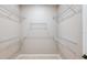 Spacious walk-in closet with multiple white wire shelves for optimal organization and storage space at 8707 Sw 57Th Ln, Ocala, FL 34481