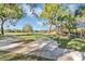 Relaxing community park with picnic tables and benches, overlooking a scenic pond at 2623 Candied Apple Aly, Kissimmee, FL 34744