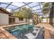 Inviting screened pool and spa with patio furniture at 3215 Helen Ave, Orlando, FL 32804