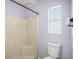 Bathroom featuring toilet, shower stall, and window at 5040 Kirkland Rd, Lakeland, FL 33811