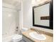 Bathroom featuring shower-tub combination, toilet, and granite vanity at 5040 Kirkland Rd, Lakeland, FL 33811