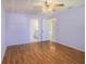 Spacious bedroom with hardwood floors and access to bathroom at 5040 Kirkland Rd, Lakeland, FL 33811