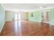 Large bonus room with hardwood floors, ceiling fans, and sliding doors to the exterior at 5040 Kirkland Rd, Lakeland, FL 33811