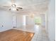 Spacious living area with tile and wood flooring, ceiling fan and abundant natural light at 5040 Kirkland Rd, Lakeland, FL 33811