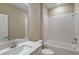 Bright bathroom showcasing a single sink vanity, quartz countertops, and a subway tiled shower-tub combo at 5329 Sw 81St Cir, Ocala, FL 34481