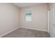 Cozy bedroom with carpet, light-filled window, and adjacent closet space at 5329 Sw 81St Cir, Ocala, FL 34481