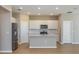 Bright kitchen featuring stainless steel appliances, white cabinets, a center island, and sleek countertops at 5329 Sw 81St Cir, Ocala, FL 34481