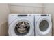 Well-equipped laundry area featuring a front-load washer and dryer for convenient laundry days at 5329 Sw 81St Cir, Ocala, FL 34481