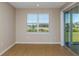 Bright and airy room with a large window and sliding glass door, showcasing natural light at 5329 Sw 81St Cir, Ocala, FL 34481