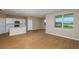Open living space featuring modern flooring, neutral paint, and a large window at 5329 Sw 81St Cir, Ocala, FL 34481