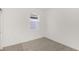 Neutral carpeted bedroom with ample natural light streaming through the window at 8223 Sw 52Nd Lane Rd, Ocala, FL 34481