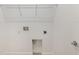 Utility room with washer and dryer hookups, top shelf, and tiled baseboard at 8223 Sw 52Nd Lane Rd, Ocala, FL 34481