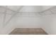 Spacious walk-in closet with carpet flooring and wire shelving, offering ample storage space at 8223 Sw 52Nd Lane Rd, Ocala, FL 34481