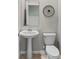 Small bathroom with pedestal sink and toilet at 1848 Bright Sky Dr, Kissimmee, FL 34744