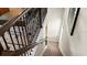 Modern staircase with metal railing and neutral carpet at 1848 Bright Sky Dr, Kissimmee, FL 34744
