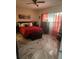 Bedroom with red bedding and large windows at 2948 W Cottage Grove Ct # Ge, Orlando, FL 32822
