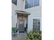 Front entrance with a small patio and green chair at 2948 W Cottage Grove Ct # Ge, Orlando, FL 32822