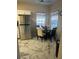 Bright kitchen nook with four chairs and large windows at 2948 W Cottage Grove Ct # Ge, Orlando, FL 32822