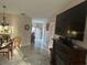 Open living area with fireplace and large TV at 2948 W Cottage Grove Ct # Ge, Orlando, FL 32822