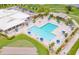 Community pool with lounge chairs at 2948 W Cottage Grove Ct # Ge, Orlando, FL 32822