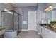 Modern bathroom showcasing a glass shower and granite vanity at 5222 Sw 88Th Cir, Ocala, FL 34481