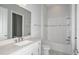 Bathroom with tub, vanity, white cabinets and a large mirror at 5222 Sw 88Th Cir, Ocala, FL 34481