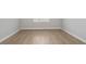 Clean and bright bedroom with natural light and wood floors at 5222 Sw 88Th Cir, Ocala, FL 34481