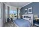 Beautiful bedroom with a large bay window and stylish decor at 5222 Sw 88Th Cir, Ocala, FL 34481