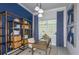 Inviting office space showcasing a modern desk and custom shelving at 5222 Sw 88Th Cir, Ocala, FL 34481