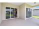 Covered patio area with sliding glass doors leading to indoor living spaces at 5222 Sw 88Th Cir, Ocala, FL 34481
