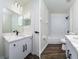 Modern bathroom with white cabinets and marble shower at 3088 Sire Trl, Lakeland, FL 33811